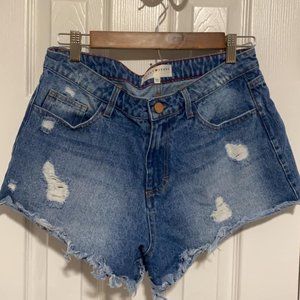 Women's Toast Jeans Jean Shorts. Distressed blue denim. Size large.